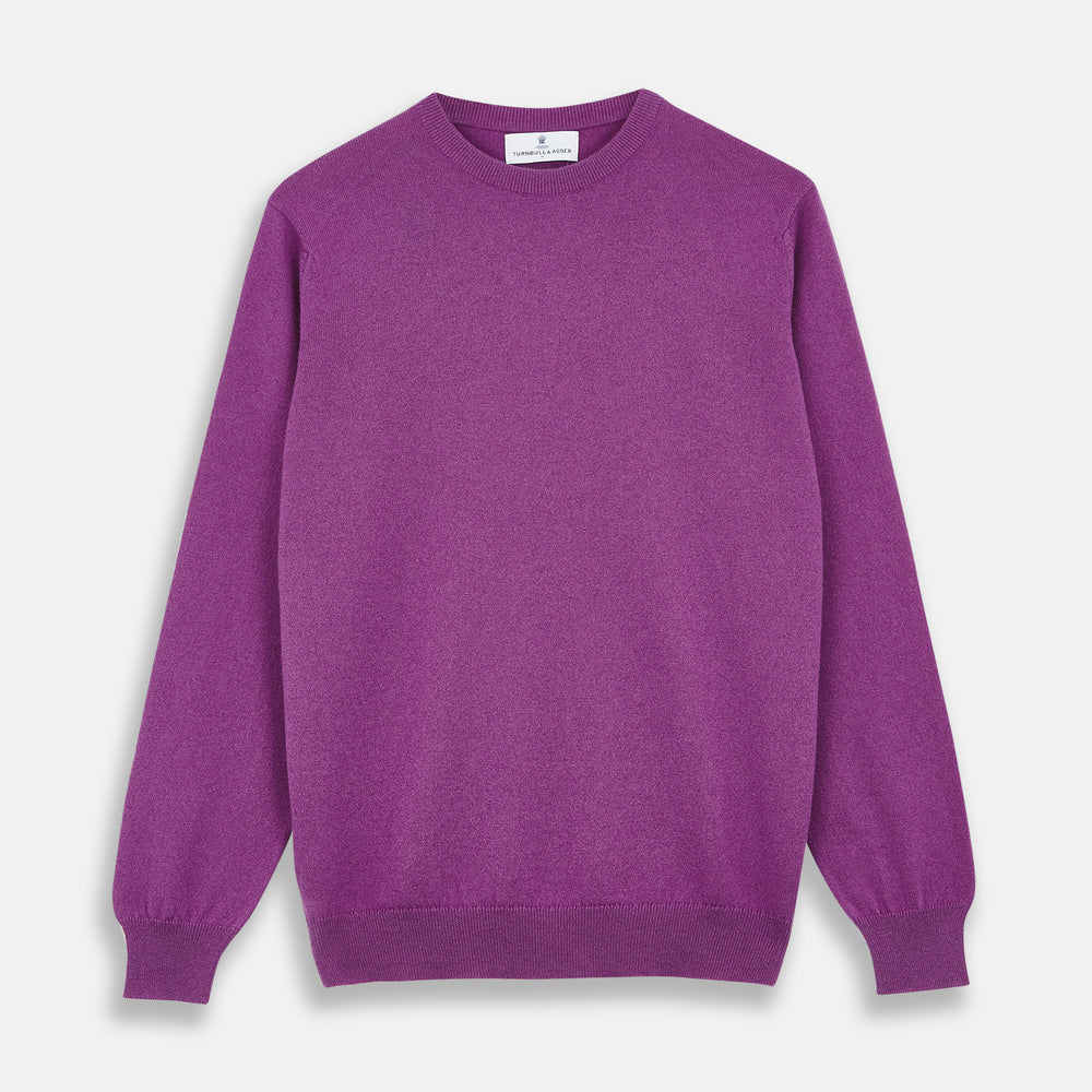 The Turnbull & Asser Magenta Cashmere Crewneck Jumper, featuring ribbed cuffs, hem, and collar, is shown against a plain white background.