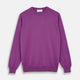 The Turnbull & Asser Magenta Cashmere Crewneck Jumper, featuring ribbed cuffs, hem, and collar, is shown against a plain white background.