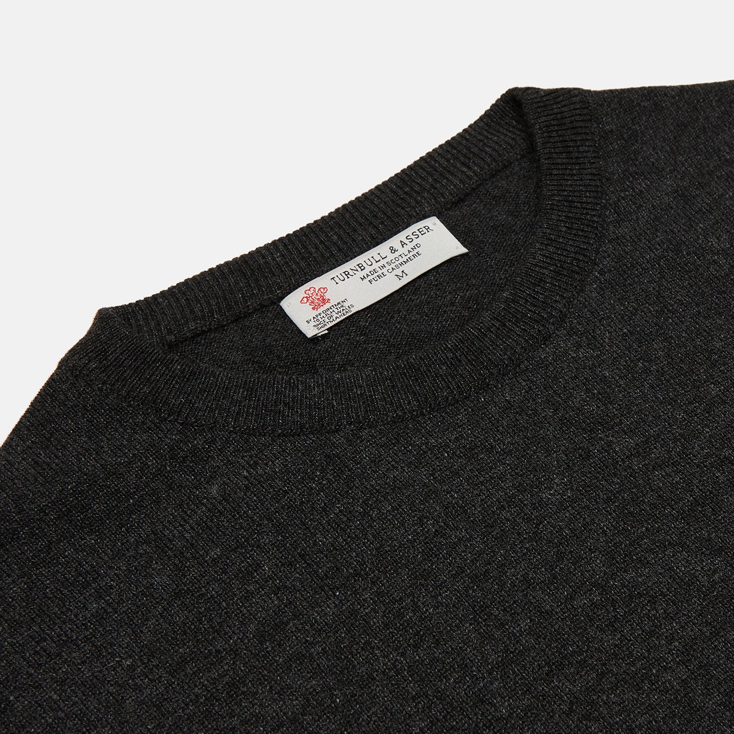 View 2 of product The Charcoal Crew Neck Cashmere Jumper by Turnbull & Asser is a luxury, long-sleeved sweater crafted from Scottish cashmere and shown on a white background.