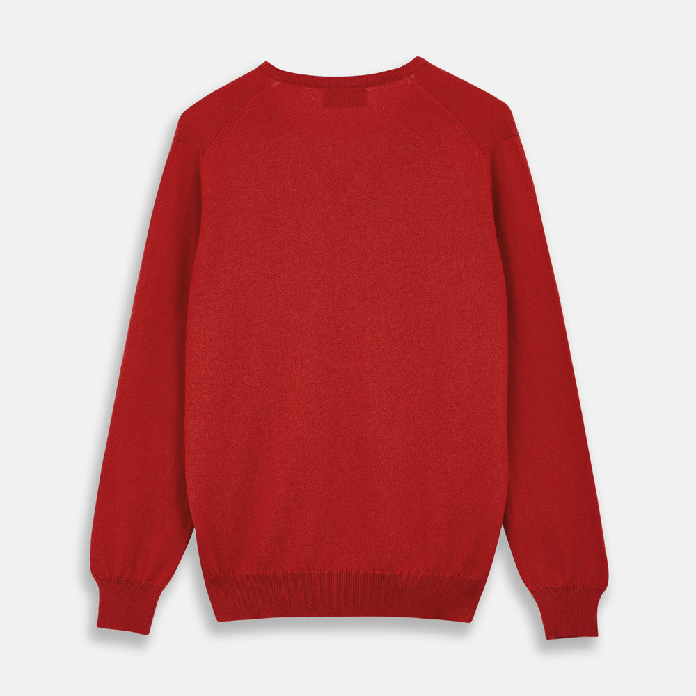 The Turnbull & Asser Red Cashmere V-Neck Jumper features long sleeves and ribbed cuffs and hem, shown laid flat on a white background.