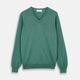 The Turnbull & Asser Green Cashmere V-Neck Jumper features long sleeves, ribbed cuffs and hem, and is styled in classic Scottish knitwear, shown flat against a white background.