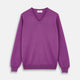 The Turnbull & Asser Magenta Cashmere V-Neck Jumper features long sleeves, ribbed cuffs, and a ribbed hem, shown against a plain white background.