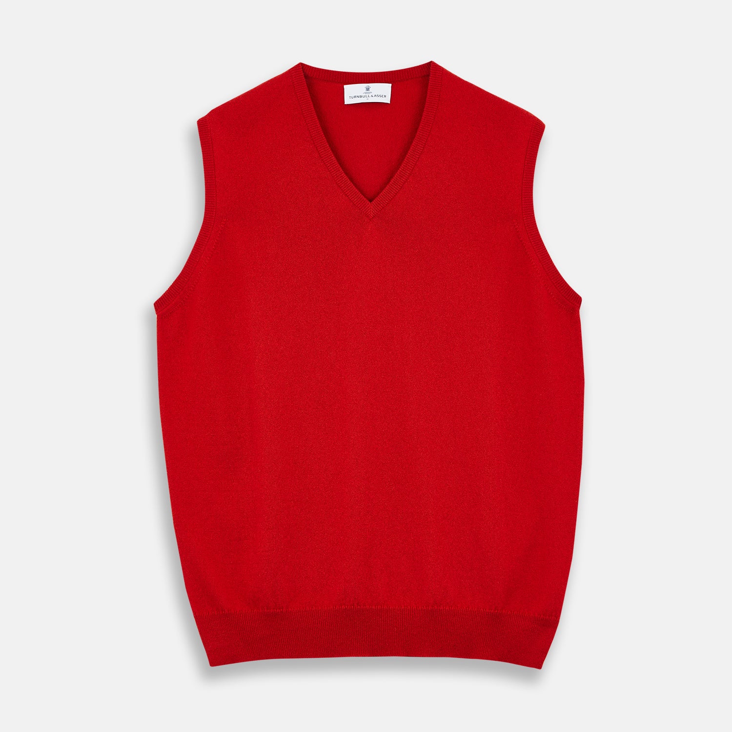 View 1 of product The Red Cashmere Slipover by Turnbull & Asser is a sleeveless, V-neck vest in pure cashmere, shown flat on a white background—an ideal lightweight layer for any season.