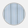 View 1 of product A close-up of Turnbull & Asser’s Green Stripe Cotton Fabric shows light blue material with evenly spaced white and dark gray vertical stripes, presented in a circular frame against a plain background.