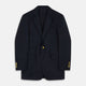 The Turnbull & Asser Navy Plain Wool Single Breasted Blazer features brass buttons on the front and cuffs, notched lapels, and multiple front pockets, shown laid flat against a white background.