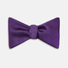 View 1 of product The Turnbull & Asser Plum Plain Satin Silk Bow Tie features a smooth texture and is neatly tied, displayed against a plain white background.