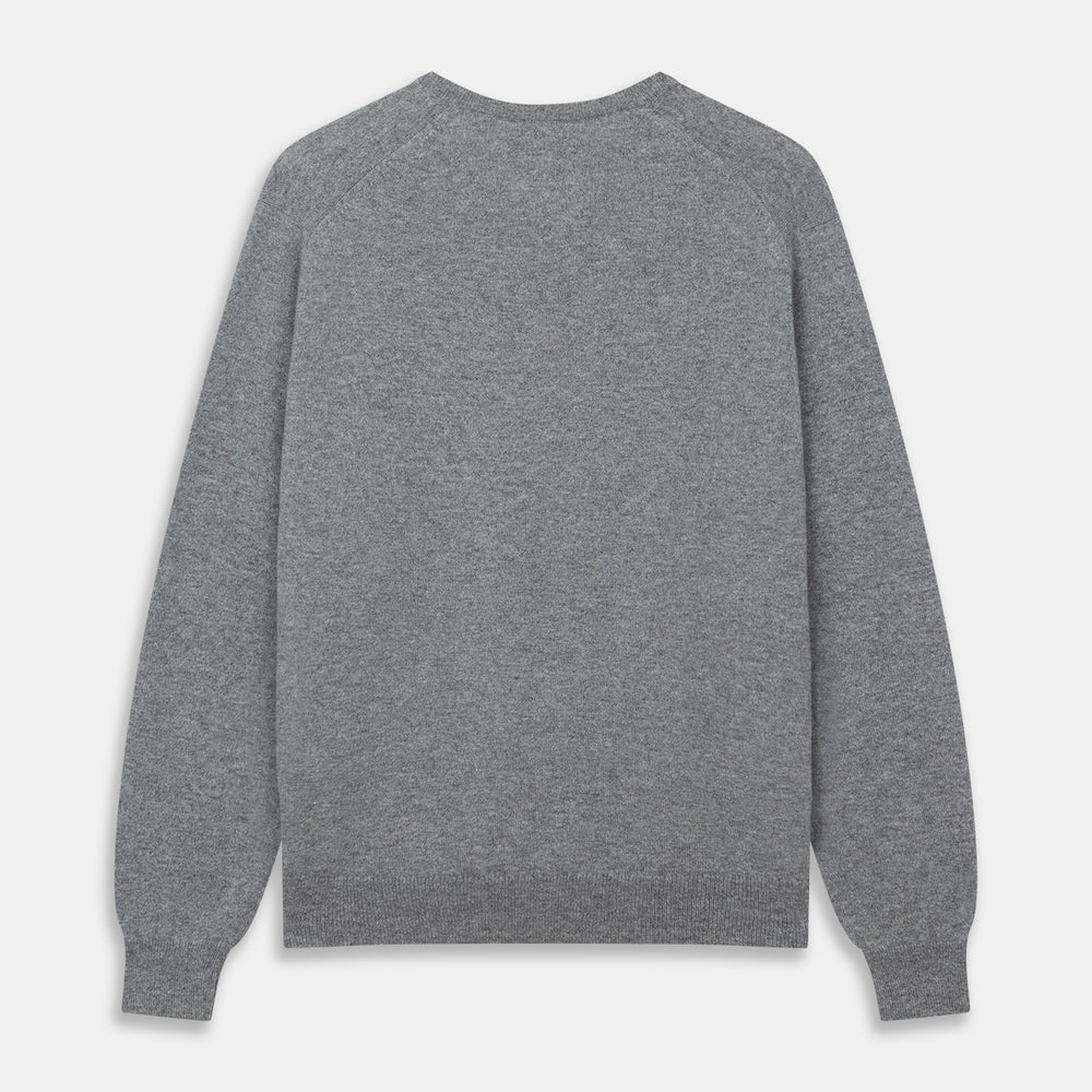 The Turnbull & Asser Flannel Grey V-Neck Cashmere Jumper, shown laid flat on a white background, features long sleeves and ribbed cuffs, hem, and neckline for a classic look with no visible patterns or embellishments.