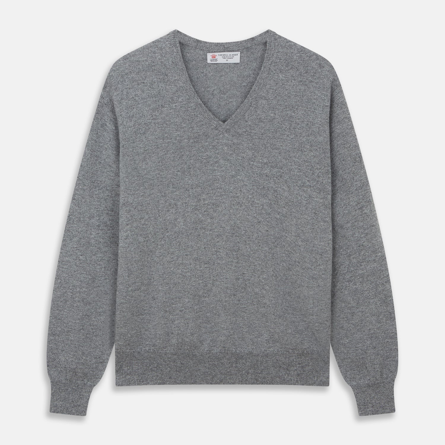 View 1 of product The Turnbull & Asser Flannel Grey V-Neck Cashmere Jumper, shown laid flat on a white background, features long sleeves and ribbed cuffs, hem, and neckline for a classic look with no visible patterns or embellishments.