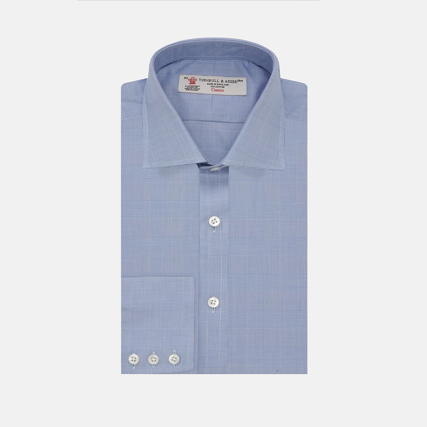 View 1 of product A Turnbull & Asser Blue Prince of Wales Check Shirt with Regent collar and button cuffs, neatly folded to show its white buttons and inside-collar label, is displayed against a plain white background.