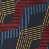View 2 of product The Navy, Red and Gold Zig Zag Silk Tie by Turnbull & Asser features a geometric pattern of zigzag stripes on a dark background and is part of our limited-run collection.