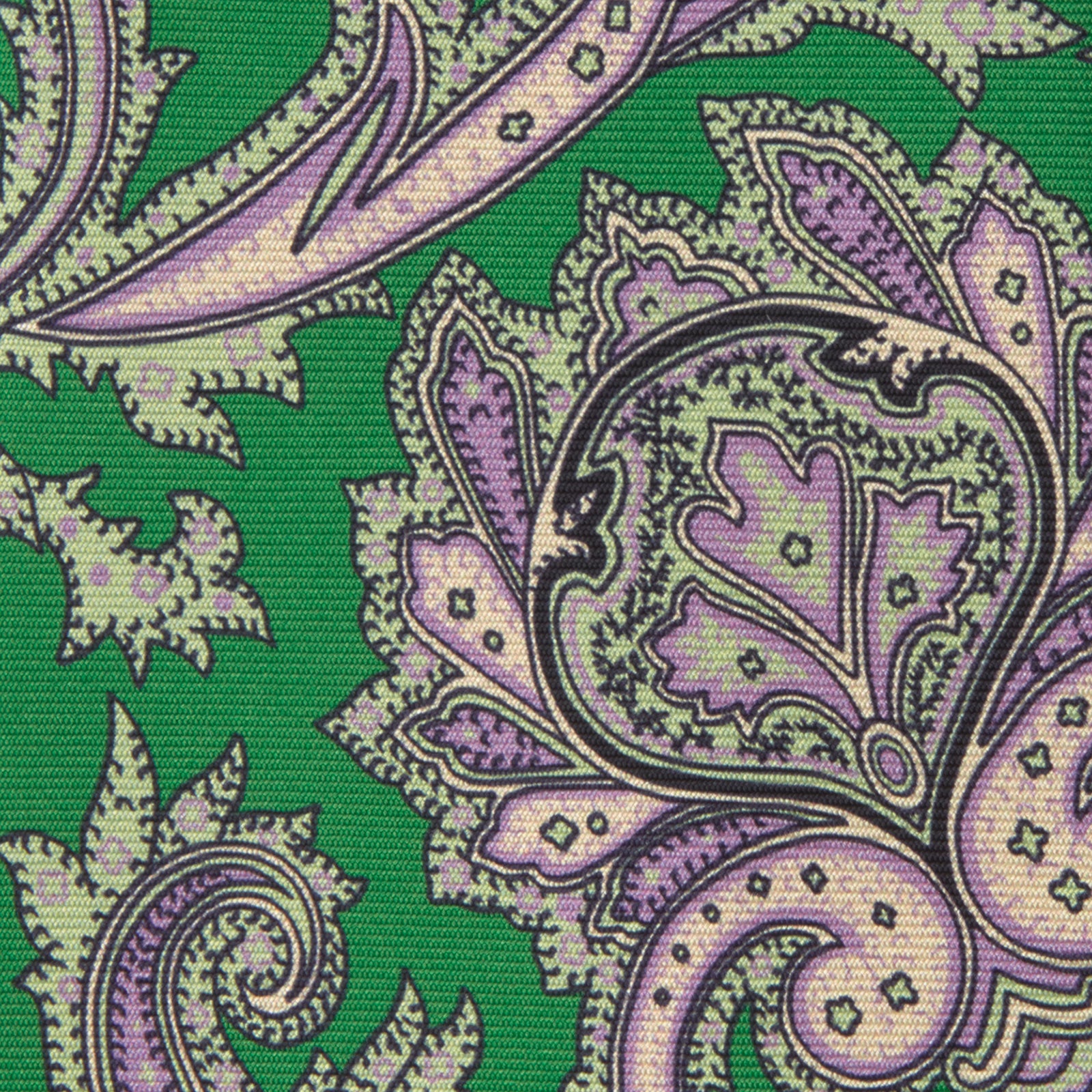View 3 of product The Turnbull & Asser Green and Purple Large Paisley Printed Silk Tie features a light purple and white intricate paisley pattern, rolled up and set against a plain white background for timeless style.