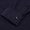 View 4 of product The Turnbull & Asser Midnight Blue Corduroy Officer Weekend Fit Shirt features a soft Dorset collar, relaxed fit, 1-button cuffs, and two button-flap chest pockets, shown on a white background.