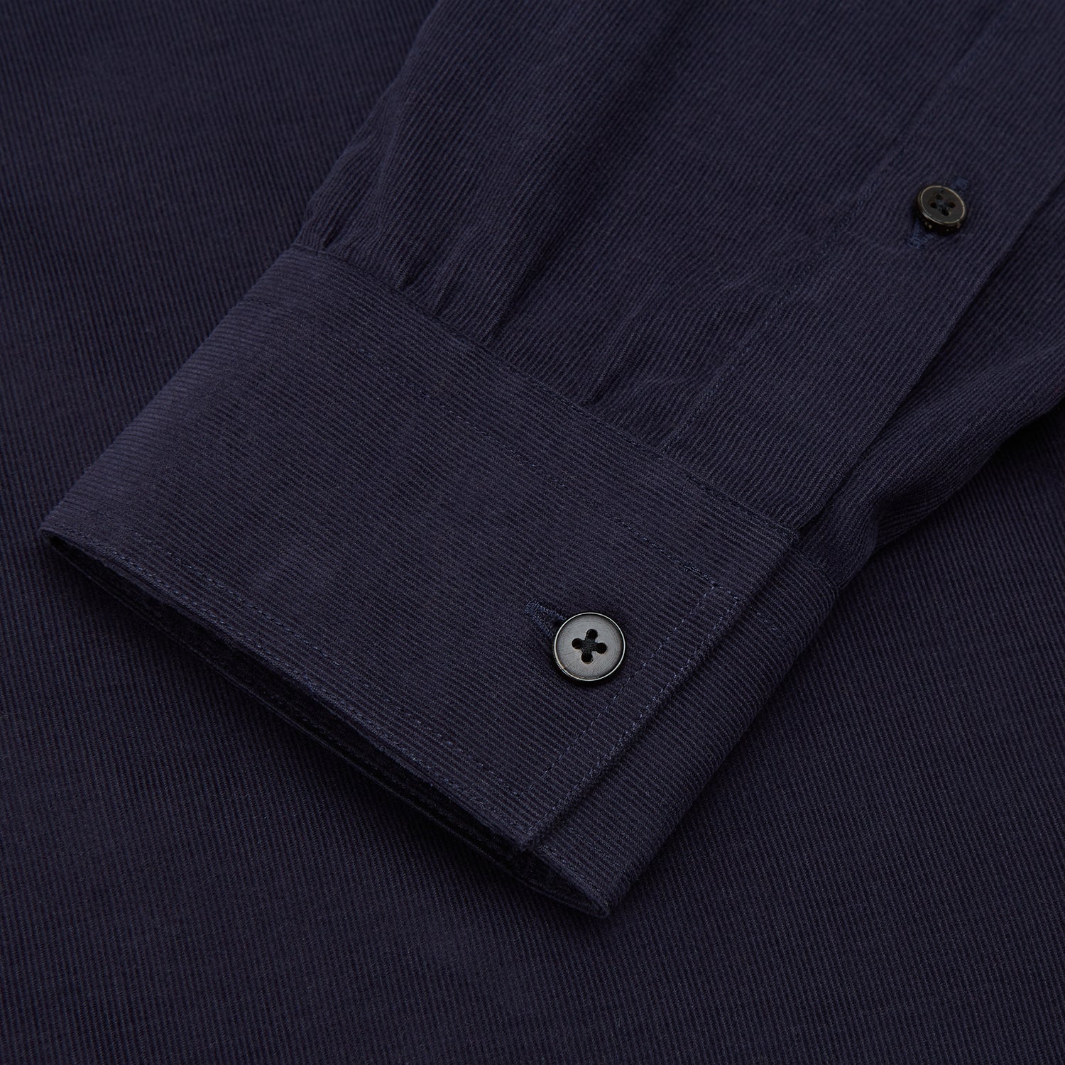 View 4 of product The Turnbull & Asser Midnight Blue Corduroy Officer Weekend Fit Shirt features a soft Dorset collar, relaxed fit, 1-button cuffs, and two button-flap chest pockets, shown on a white background.