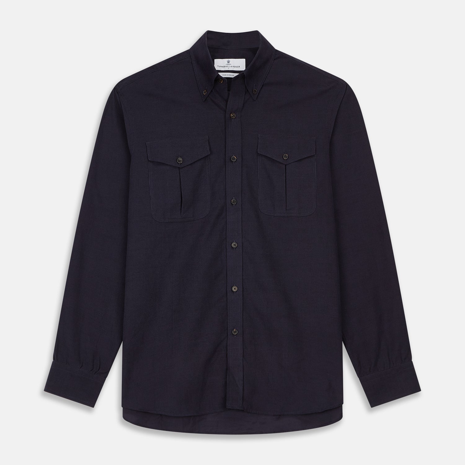View 1 of product The Turnbull & Asser Midnight Blue Corduroy Officer Weekend Fit Shirt features a soft Dorset collar, relaxed fit, 1-button cuffs, and two button-flap chest pockets, shown on a white background.