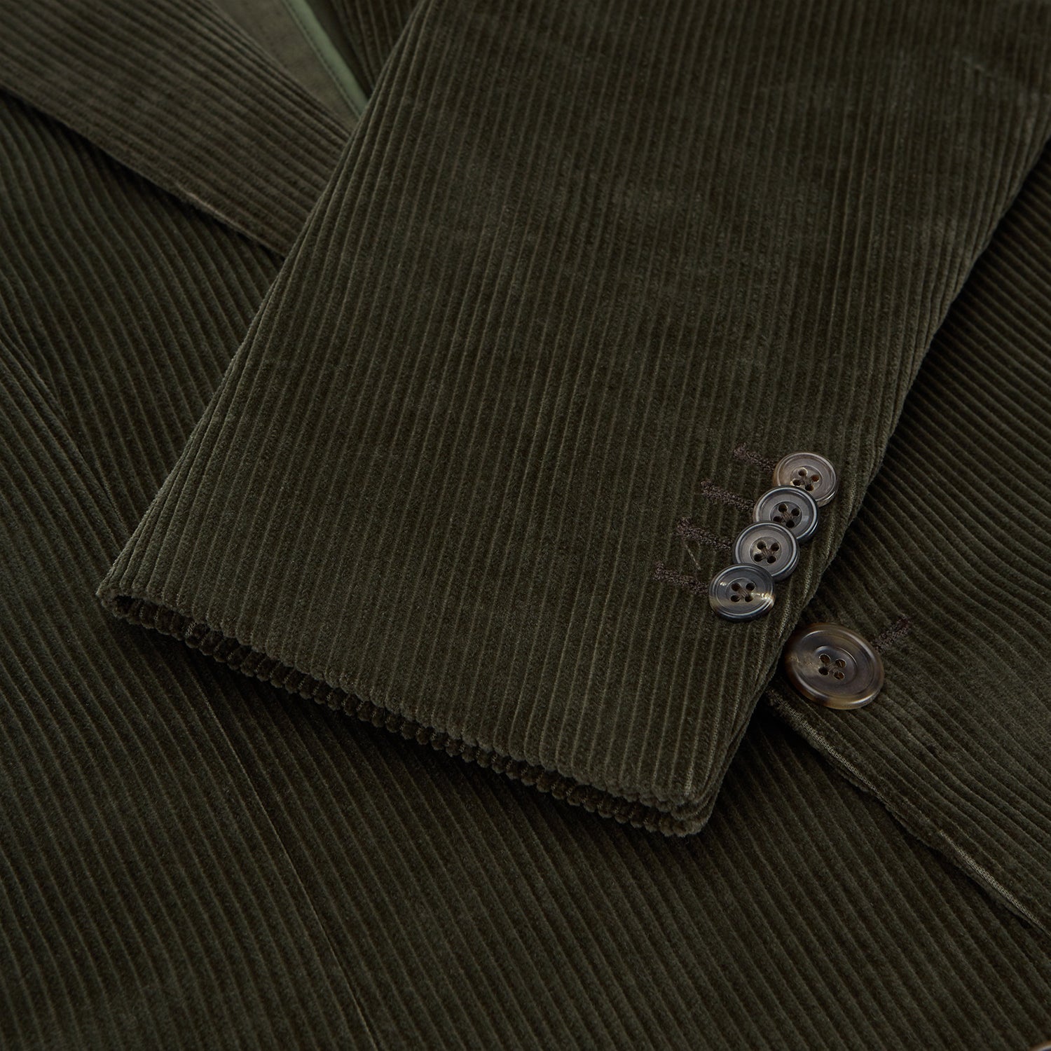 View 2 of product The Turnbull & Asser Olive Green Corduroy Jacket, crafted from pure cotton with notched lapels, two buttons, patch and welt chest pockets, displays Italian tailoring and is shown laid flat on a white background.