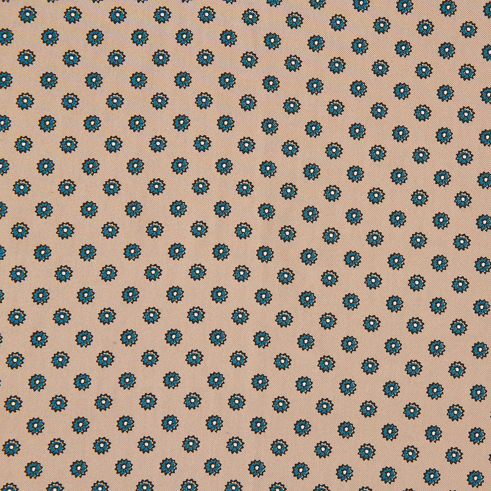 The Copper Fine Floral Print Silk Pocket Square by Turnbull & Asser features a refined floral pattern in silk, with the brand’s name discreetly displayed in one corner—a perfect choice for those who appreciate elegant pocket squares.
