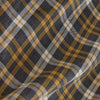View 4 of product The Turnbull & Asser Yellow Check Weekend Fit Flannel Shirt features a Derby collar, 1-button cuffs, and a yellow, black, and white plaid pattern. It is shown laid flat on a white background.