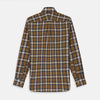 View 5 of product The Turnbull & Asser Yellow Check Weekend Fit Flannel Shirt features a Derby collar, 1-button cuffs, and a yellow, black, and white plaid pattern. It is shown laid flat on a white background.
