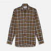View 1 of product The Turnbull & Asser Yellow Check Weekend Fit Flannel Shirt features a Derby collar, 1-button cuffs, and a yellow, black, and white plaid pattern. It is shown laid flat on a white background.