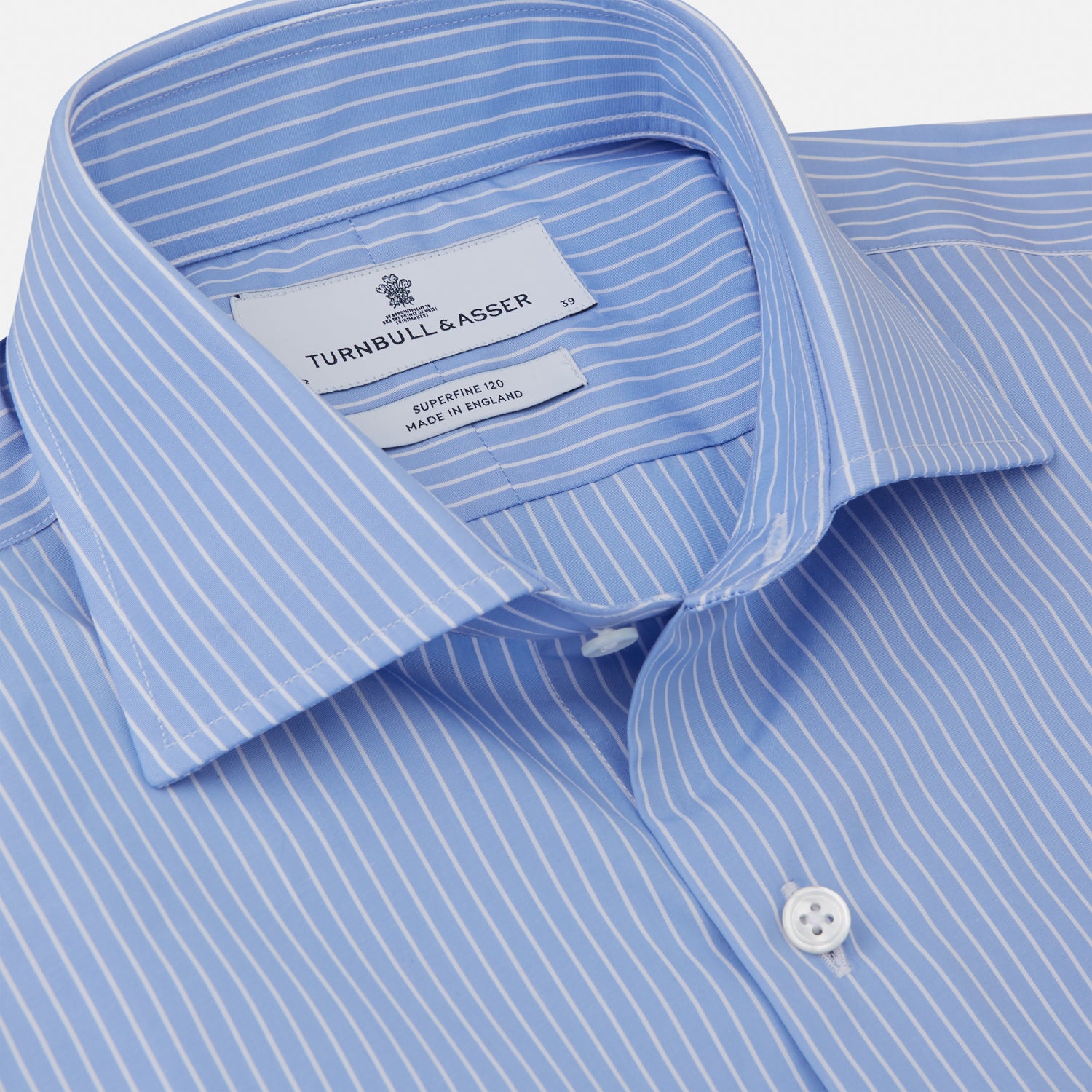 View 2 of product The Turnbull & Asser Powder Blue Stripe Tailored Fit Shirt features a Kent collar and 2-button cuffs, with powder blue and white vertical pinstripes, shown against a plain white background.