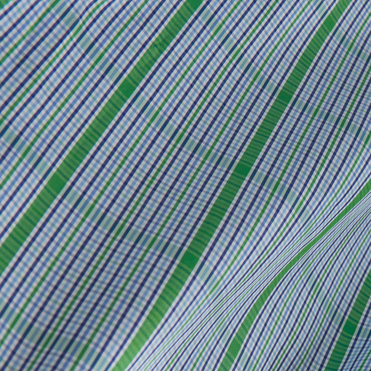 View 4 of product The Turnbull & Asser Green and Blue Fancy Check Regular Fit Shirt features a T&A collar and white buttons, displayed against a plain white background.