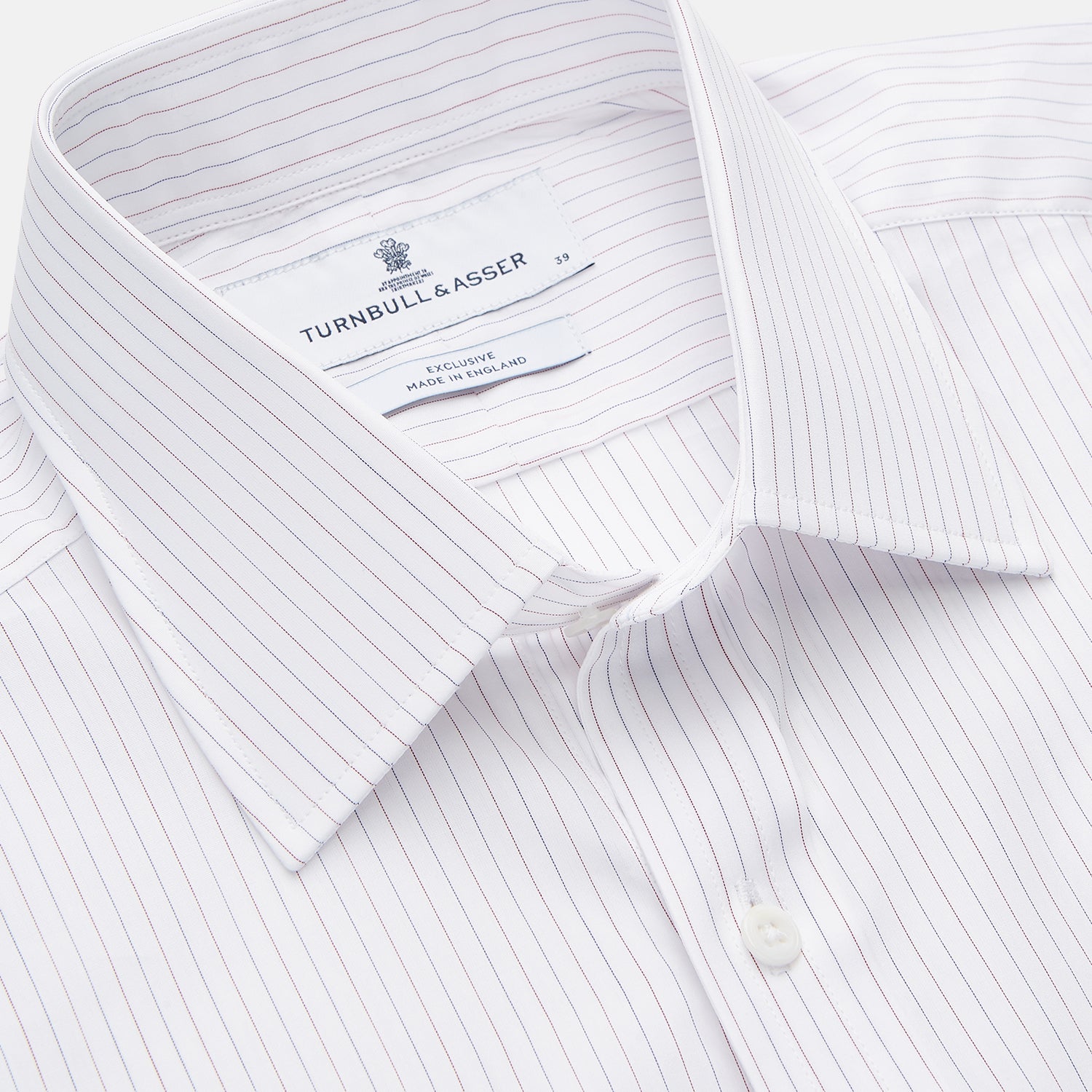 View 2 of product The Turnbull & Asser Red & White Stripe Sea Island Quality Cotton Regular Fit Mayfair Shirt features a classic T&A collar, button-down front, and buttoned cuffs, shown laid flat on a white background.