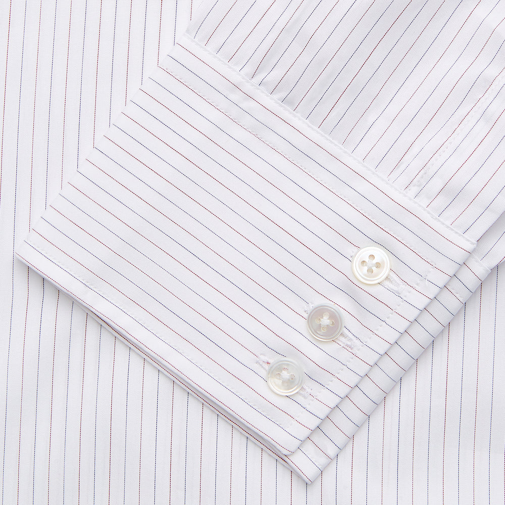 The Turnbull & Asser Red & White Stripe Sea Island Quality Cotton Regular Fit Mayfair Shirt features a classic T&A collar, button-down front, and buttoned cuffs, shown laid flat on a white background.
