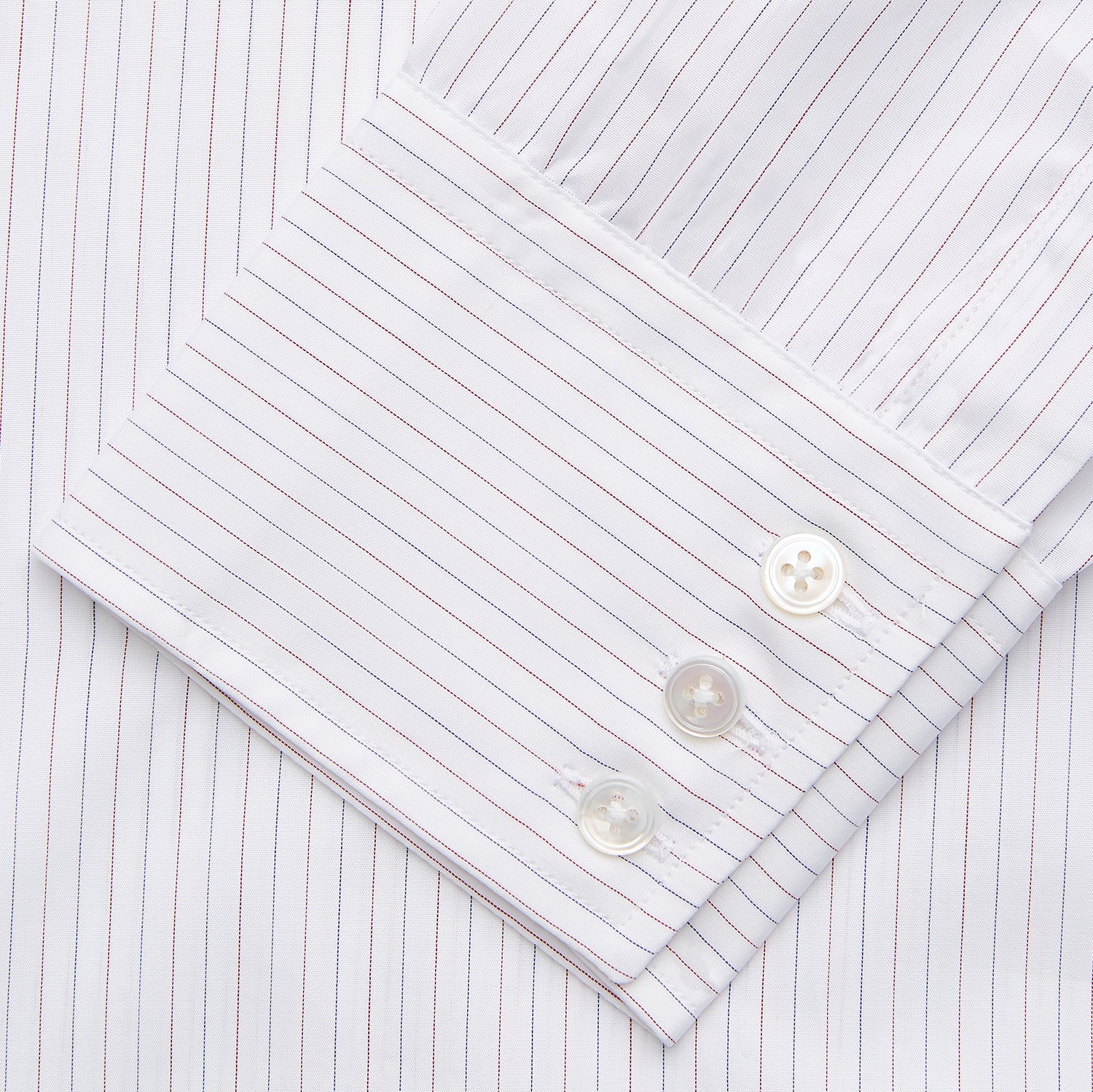View 3 of product The Turnbull & Asser Red & White Stripe Sea Island Quality Cotton Regular Fit Mayfair Shirt features a classic T&A collar, button-down front, and buttoned cuffs, shown laid flat on a white background.