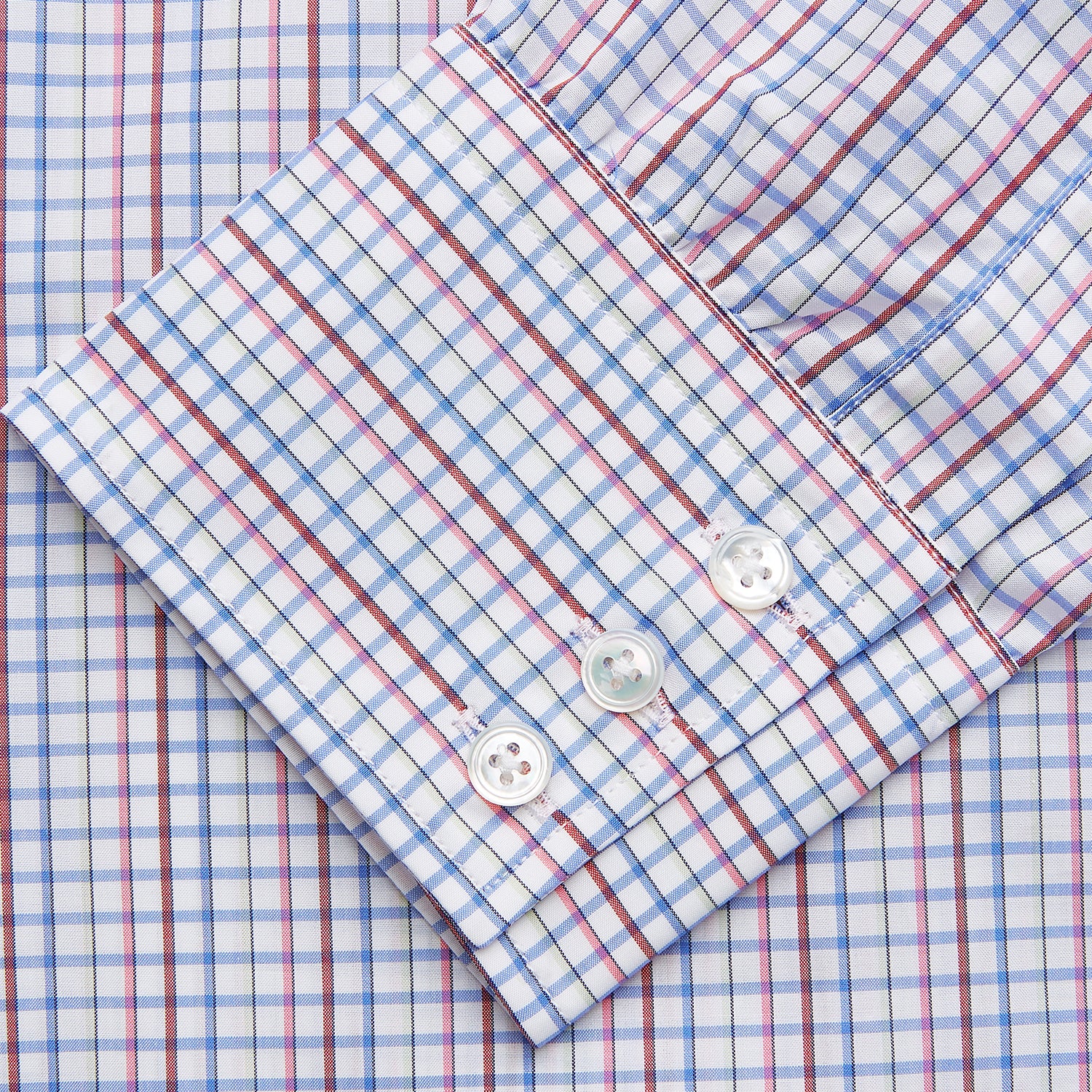 View 3 of product The Red Multi Blazer Check Regular Fit Mayfair Shirt by Turnbull & Asser features a T&A collar and long sleeves, showcasing a blue and red checkered pattern on white, set against a plain white backdrop.