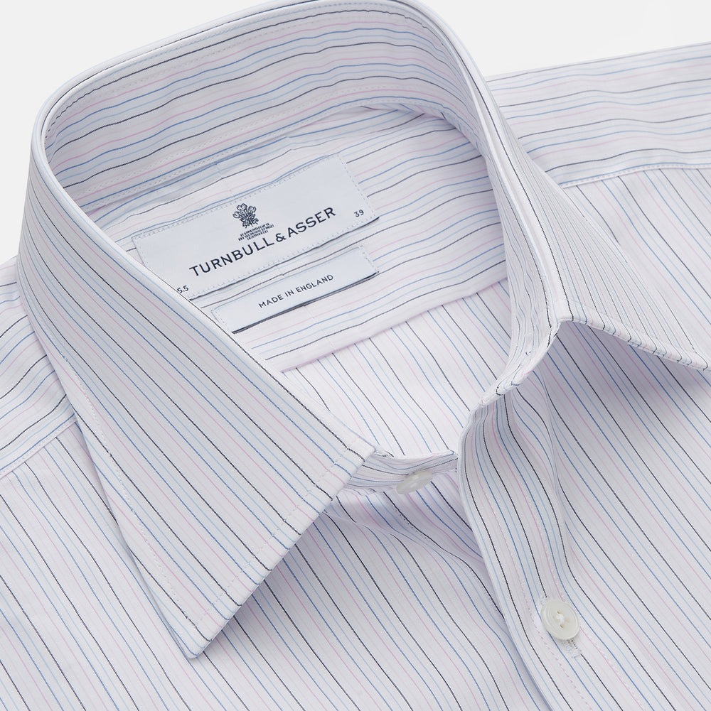 The Turnbull & Asser Blue Multi Stripe Regular Fit Mayfair Shirt features light blue vertical stripes on white, a classic collar, long sleeves, and buttoned cuffs, displayed on a plain white surface.