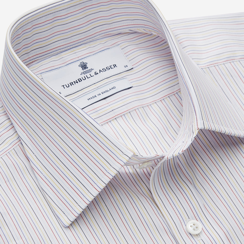 The Turnbull & Asser Red Multi Stripe Regular Fit Mayfair Shirt features long sleeves, a button-down design, classic collar, and subtle red vertical stripes on white, shown laid flat.