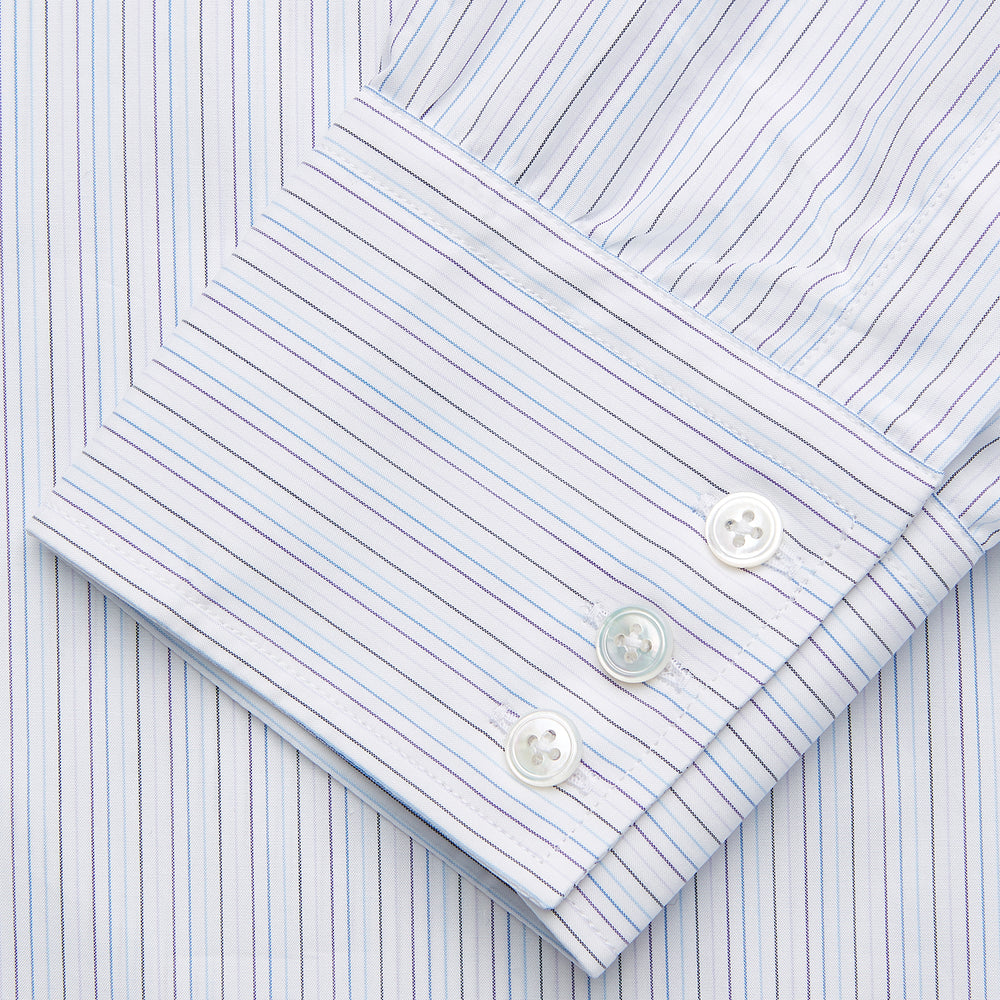 The Purple Multi Stripe Regular Fit Mayfair Shirt by Turnbull & Asser features long sleeves, a classic collar, and buttoned cuffs—perfect for achieving a refined yet relaxed style.