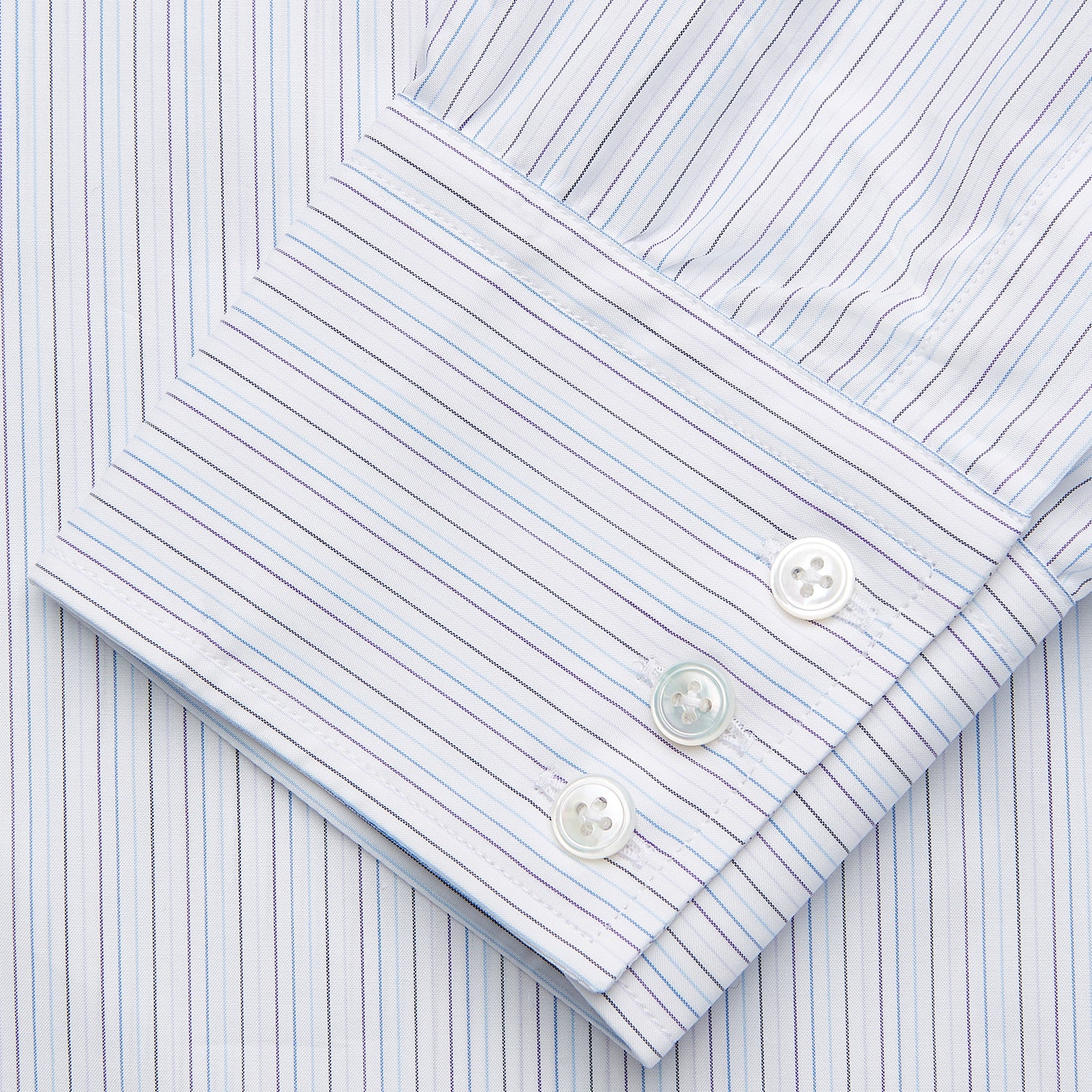 View 3 of product The Purple Multi Stripe Regular Fit Mayfair Shirt by Turnbull & Asser features long sleeves, a classic collar, and buttoned cuffs—perfect for achieving a refined yet relaxed style.