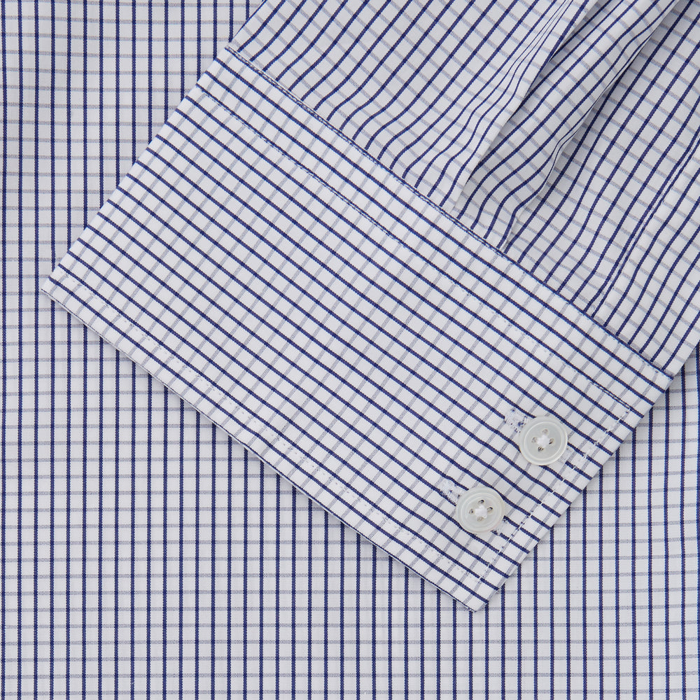 The Turnbull & Asser Blue Check Tailored Fit Shirt features a Kent collar, 2-button cuffs, and white buttons. Made from fine Italian cotton with a small blue and white checkered pattern, it's displayed on a plain white background.