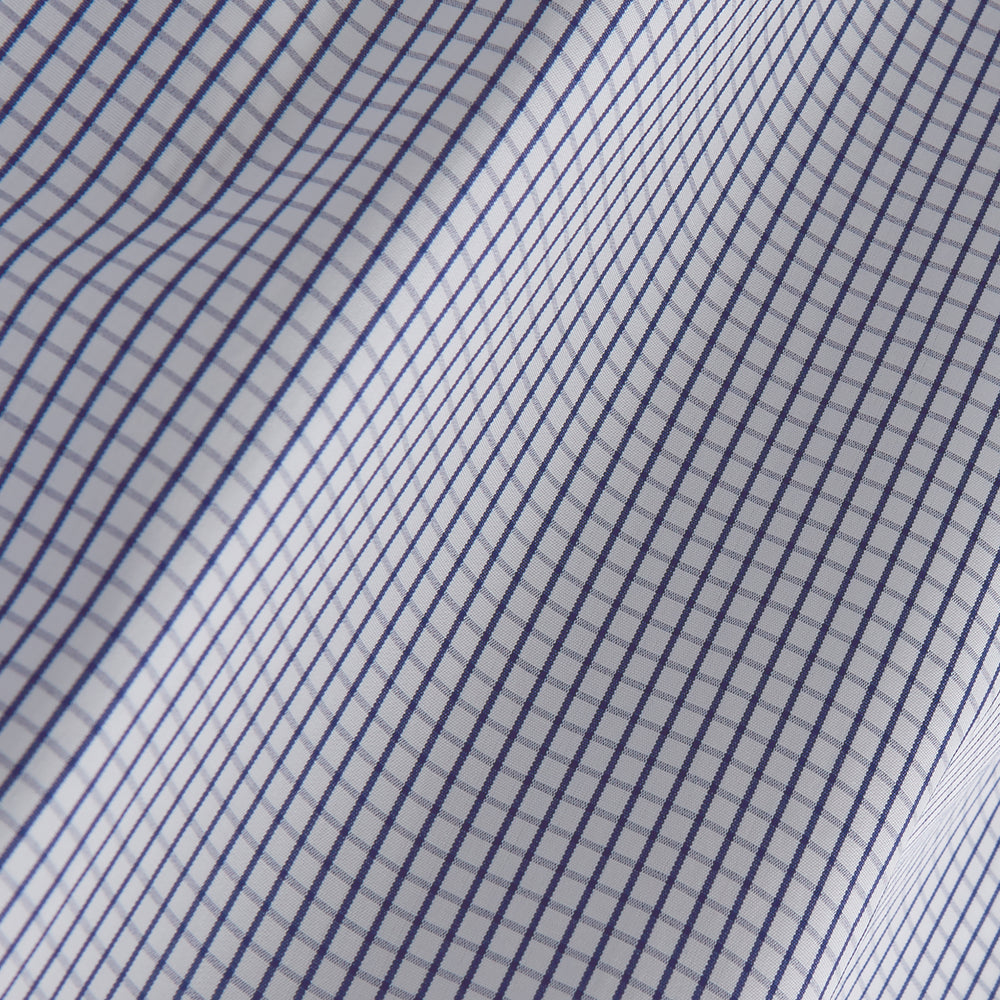 The Turnbull & Asser Blue Check Tailored Fit Shirt features a Kent collar, 2-button cuffs, and white buttons. Made from fine Italian cotton with a small blue and white checkered pattern, it's displayed on a plain white background.