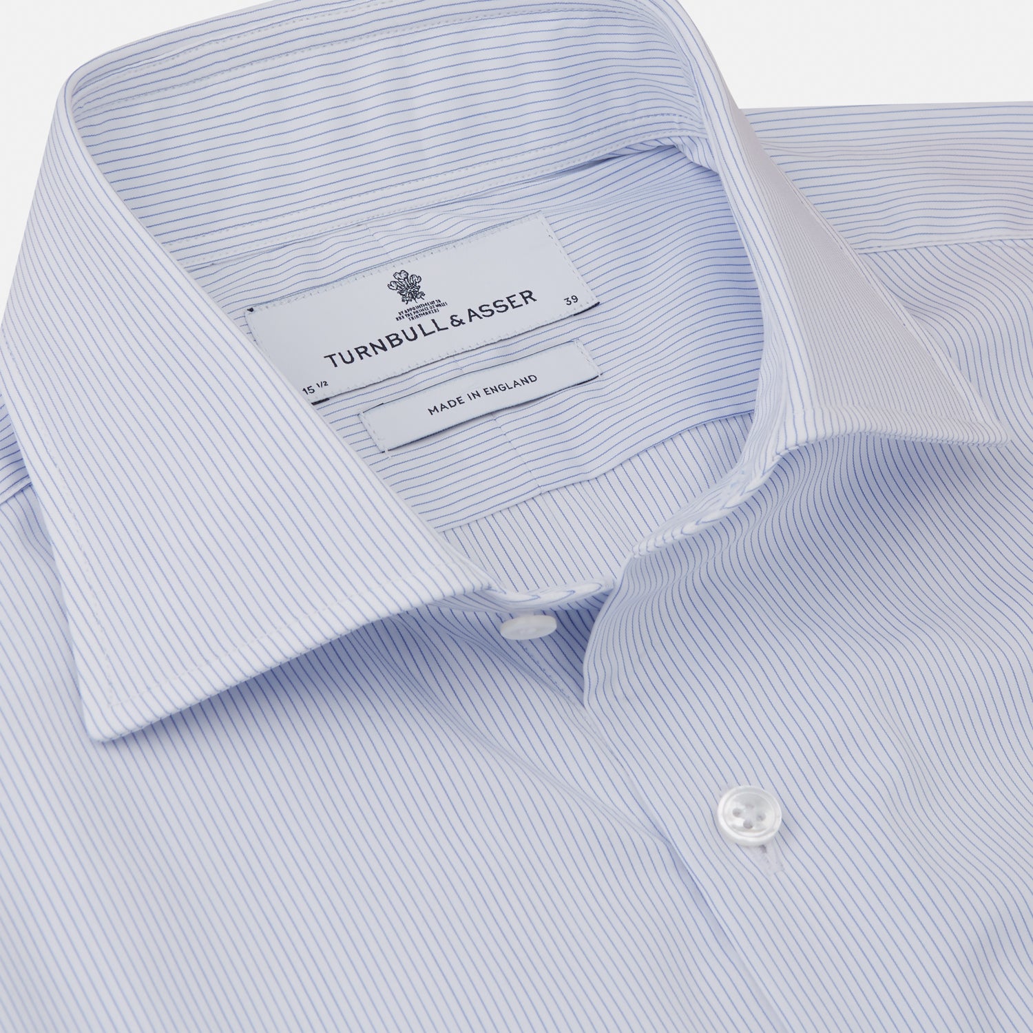 View 2 of product The Turnbull & Asser Sky Blue Bengal Stripe Tailored Fit Shirt features a Kent collar and 2-button cuffs, displayed neatly flat against a white background.