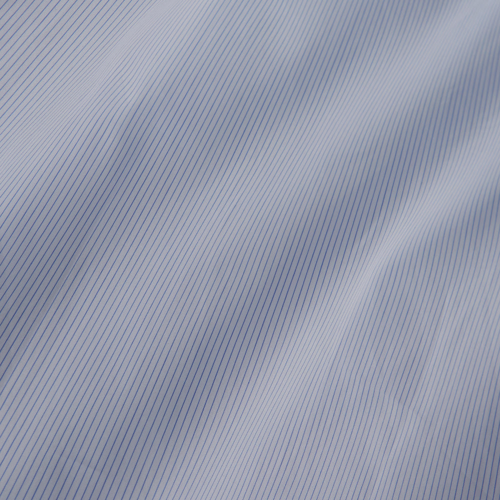 The Turnbull & Asser Sky Blue Bengal Stripe Tailored Fit Shirt features a Kent collar and 2-button cuffs, displayed neatly flat against a white background.