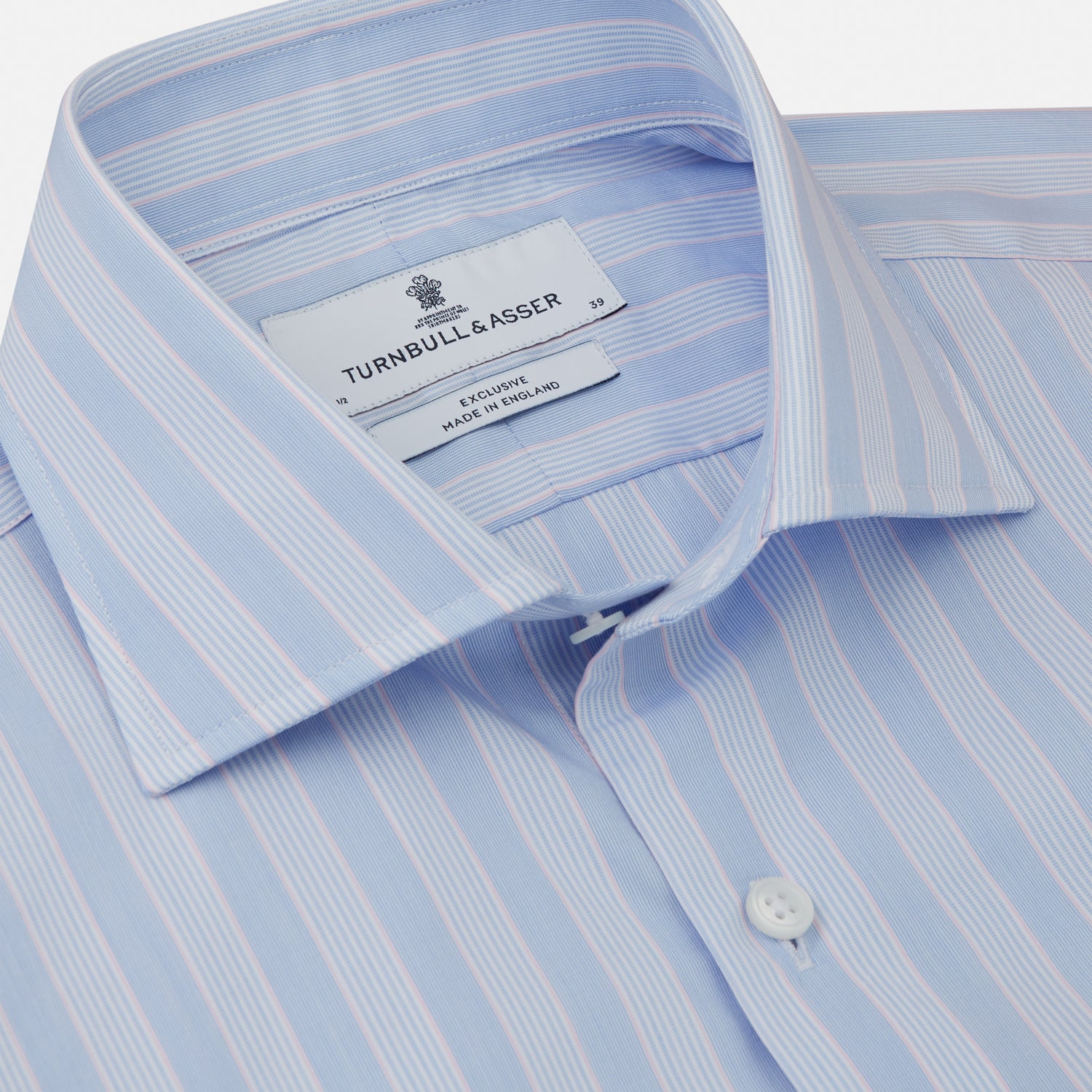 View 2 of product The Turnbull & Asser Pink and Blue Stripe Tailored Fit Shirt with a Kent collar is neatly laid flat on a plain white background.