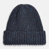 View 1 of product The Turnbull & Asser Navy Donegal Ribbed Merino Hat features thick ribbed knitting, a folded brim, and subtle lighter blue and red flecks throughout the merino yarn, shown against a plain white background.