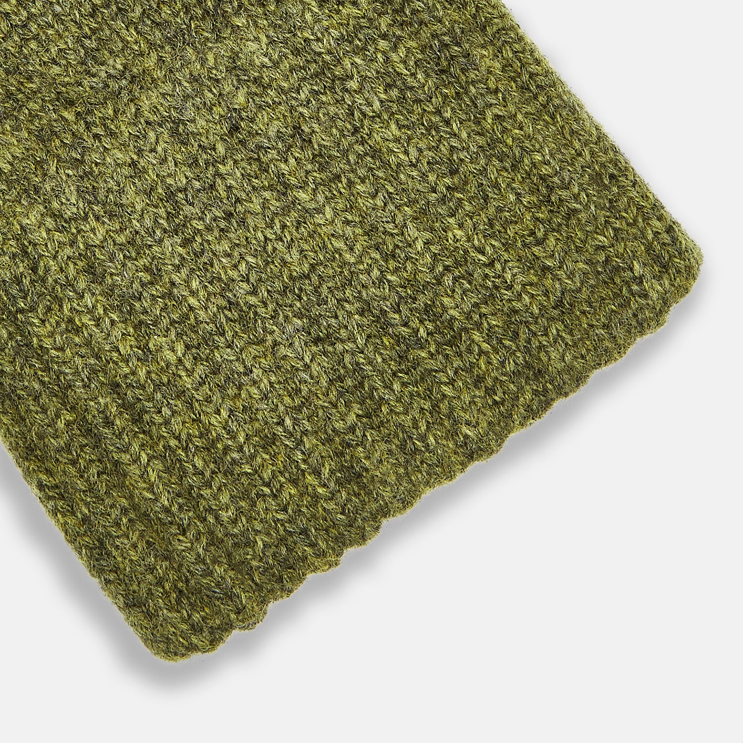 View 2 of product Turnbull & Asser's Green Multi Cashmere Gloves—an elegant Scottish knitwear piece—feature ribbed cuffs and an olive-toned design, showcased here laid flat on a white background.