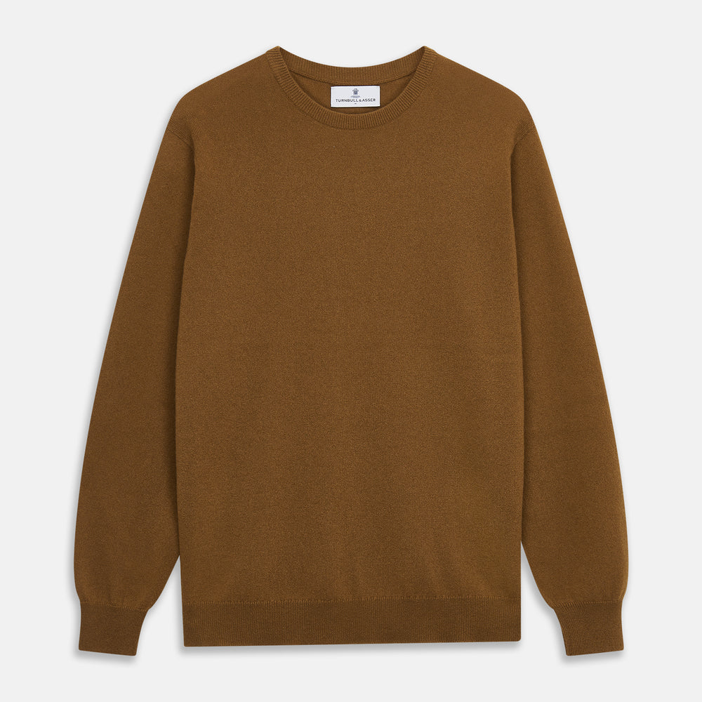 The Vicuna Glenn Cashmere Crew Neck Jumper by Turnbull & Asser is a brown crew neck sweater with long sleeves, ribbed cuffs, hem, and neckline, displayed flat on a white background for a classic look.