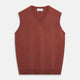The Turnbull & Asser Burgundy Ifor Cashmere Slipover, a sleeveless V-neck design in fine knit, is shown laid flat on a white background; the neck lining displays a small label, highlighting its Scottish craftsmanship.