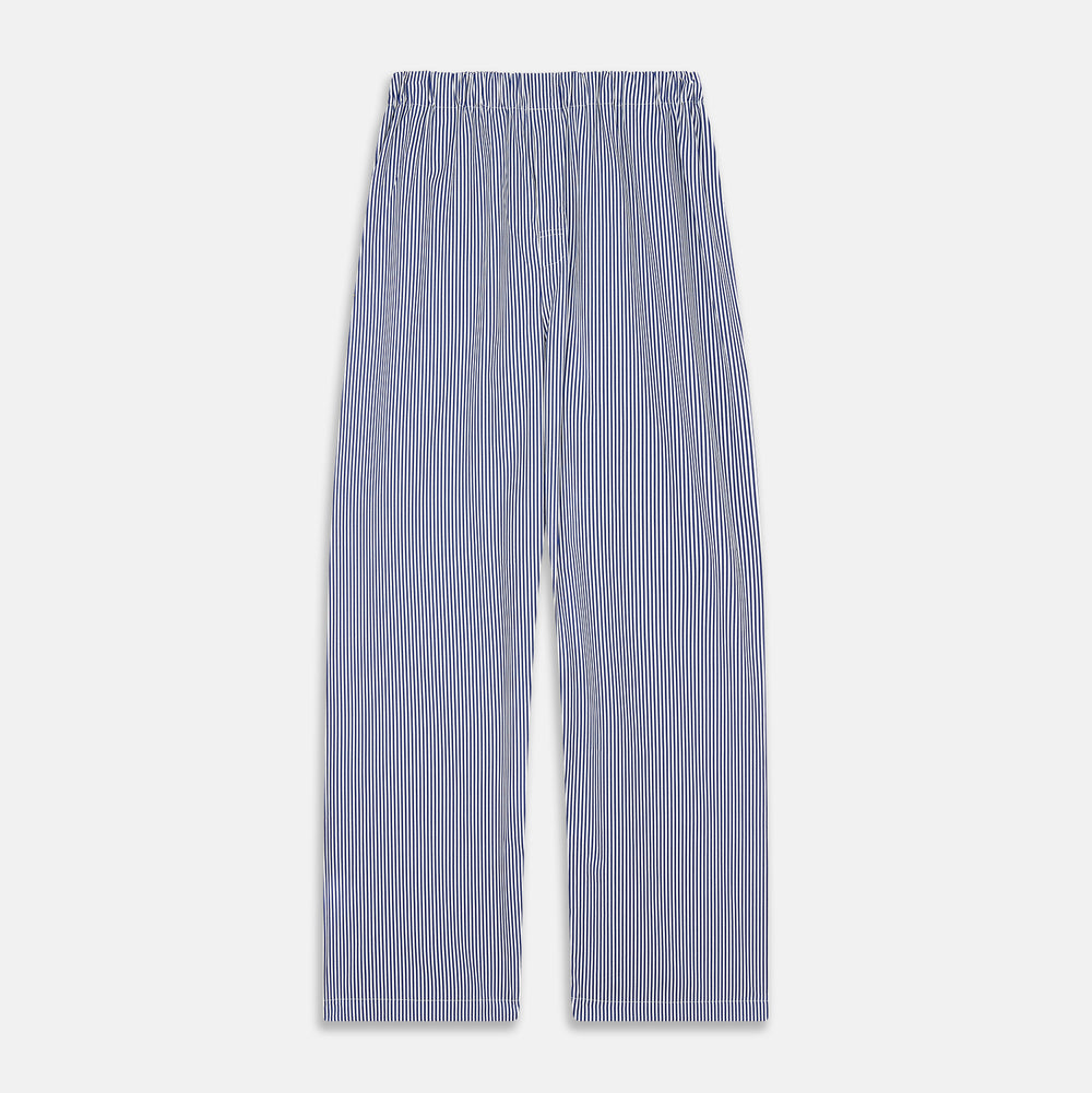 The Turnbull & Asser Navy & White Stripe Cotton Modern Pyjama Set features blue and white Bengal stripes with red piping, a long-sleeve button-up top, chest pocket, and matching pants. Shown laid flat on a white background.