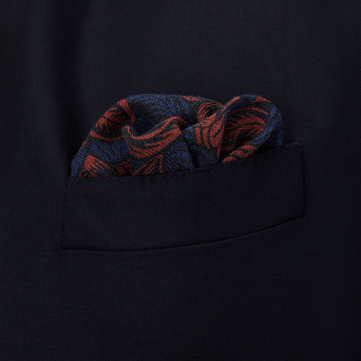 View 3 of product The Turnbull & Asser Navy Multi Camo Birds Wool Twill Pocket Square features a colorful camo bird pattern on navy wool twill with multicolor borders and a geometric edge design. Made in Italy.