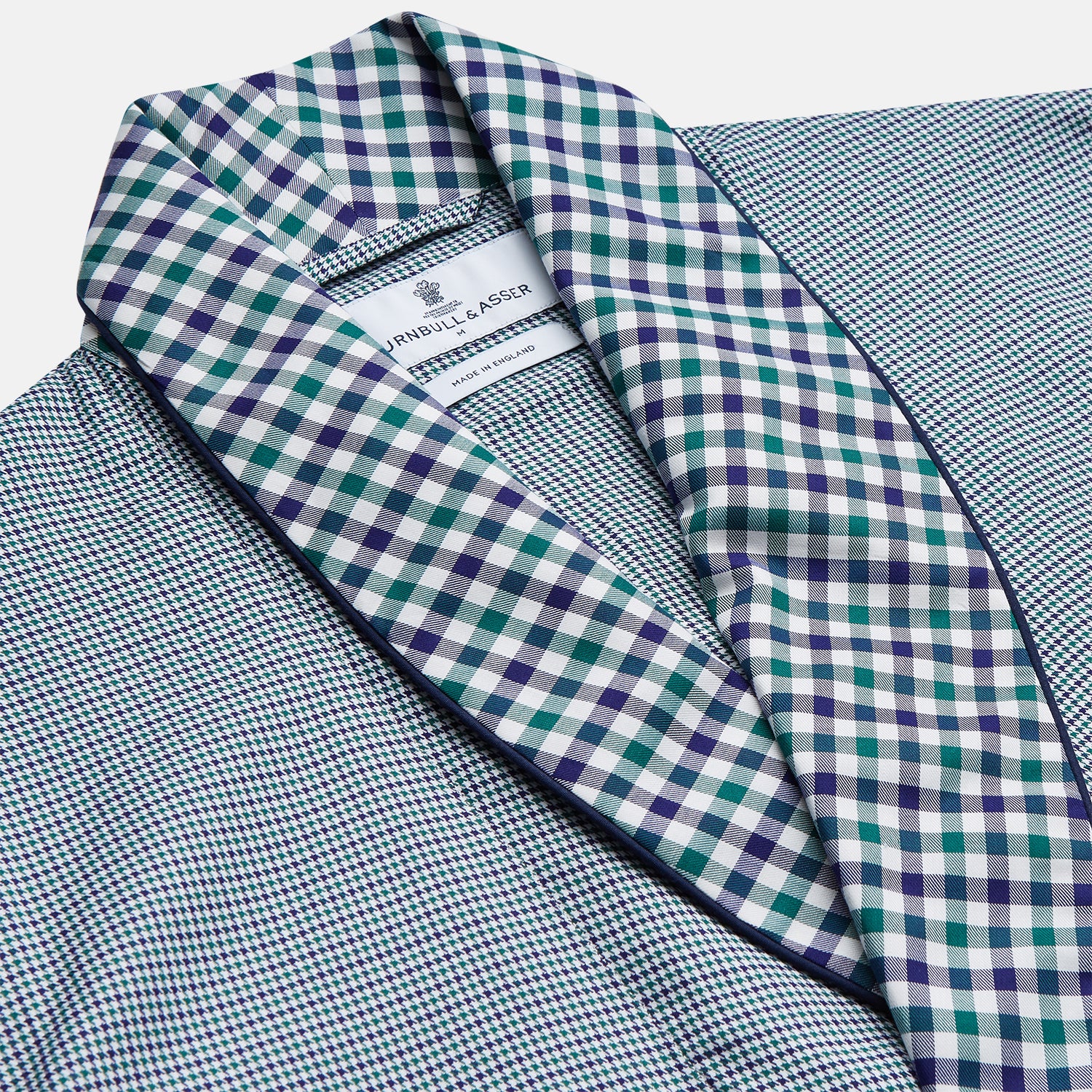 View 2 of product A Turnbull & Asser Green Multi Check Contrast Cotton Gown with a belt, featuring checkered trim on the collar, pocket, cuffs, and hem, laid flat on a white background.