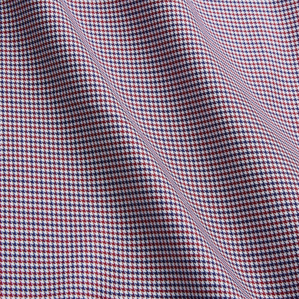 The Turnbull & Asser Burgundy Multi Check Contrast Cotton Gown features a long silhouette with a shawl collar, waist tie, and three pockets, accented by red, black, and white checkered trim—ideal for luxurious nights at home.
