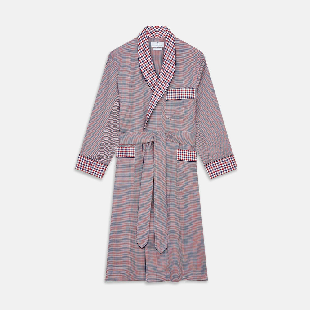 The Turnbull & Asser Burgundy Multi Check Contrast Cotton Gown features a long silhouette with a shawl collar, waist tie, and three pockets, accented by red, black, and white checkered trim—ideal for luxurious nights at home.