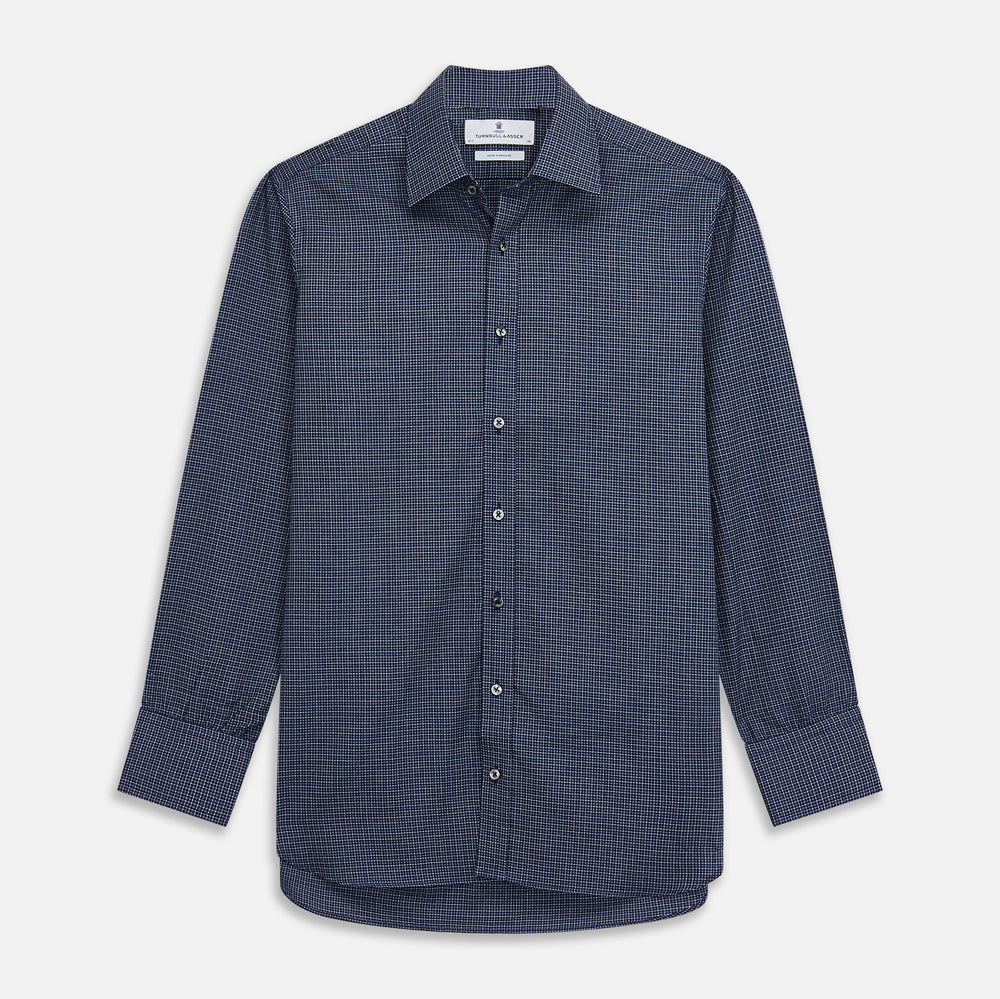 A man in a tie wears the Turnbull & Asser Navy Check Regular Fit Flannel Shirt with T&A collar and 3 button cuffs.