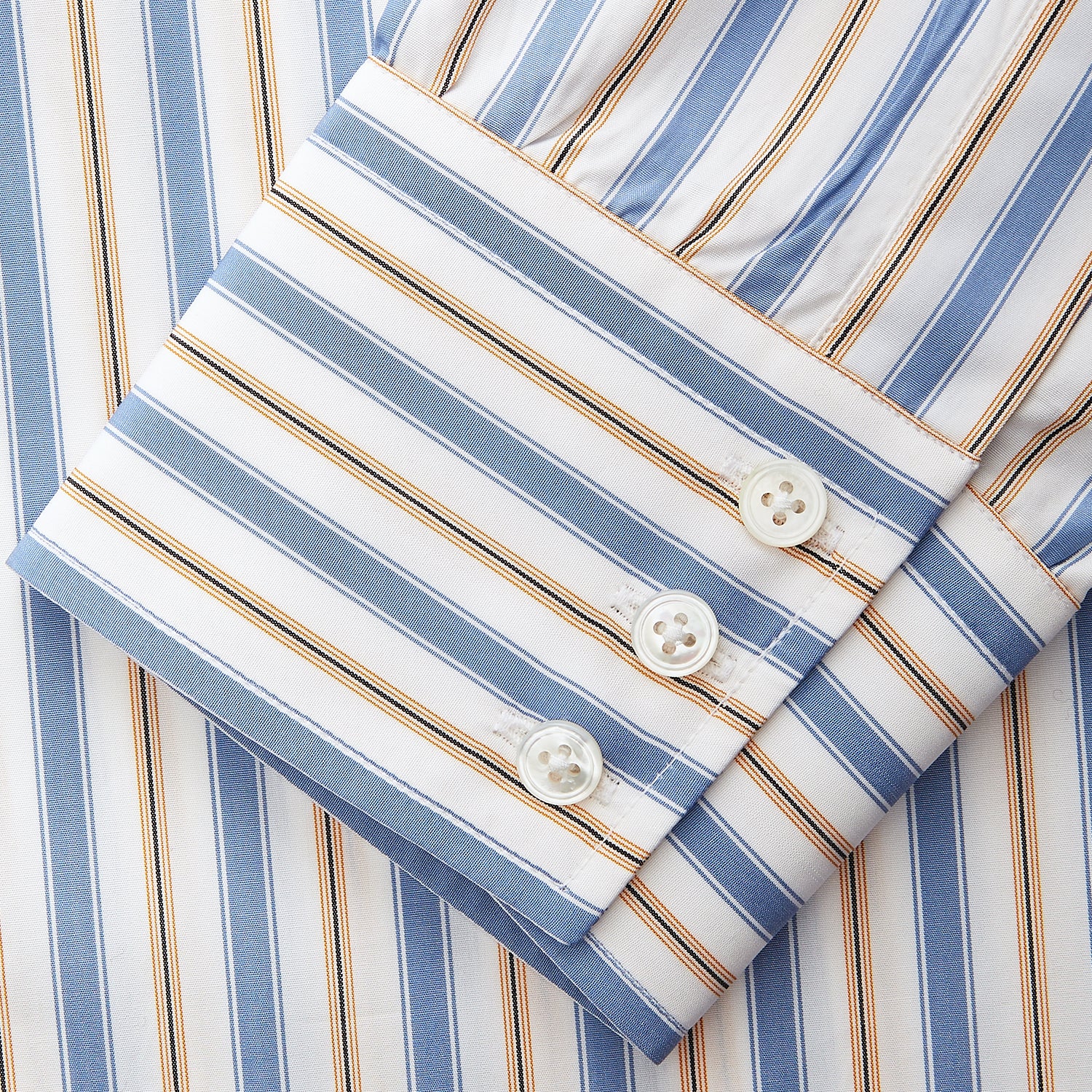View 5 of product The Turnbull & Asser Blue Multi Stripe Regular Fit Shirt features a classic T&A collar, 3 button cuffs, and vertical blue, white, and yellow stripes for a timeless look.