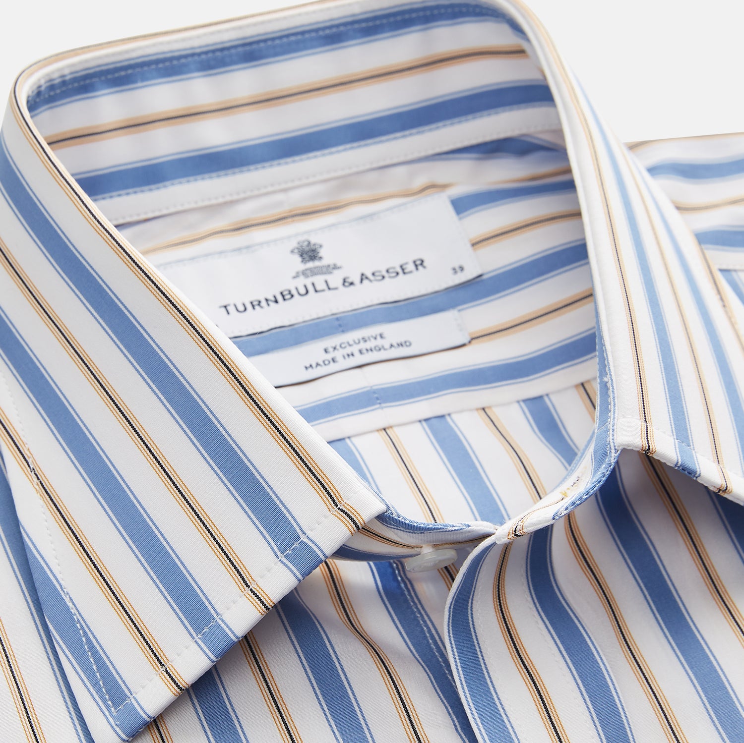 View 4 of product The Turnbull & Asser Blue Multi Stripe Regular Fit Shirt features a classic T&A collar, 3 button cuffs, and vertical blue, white, and yellow stripes for a timeless look.